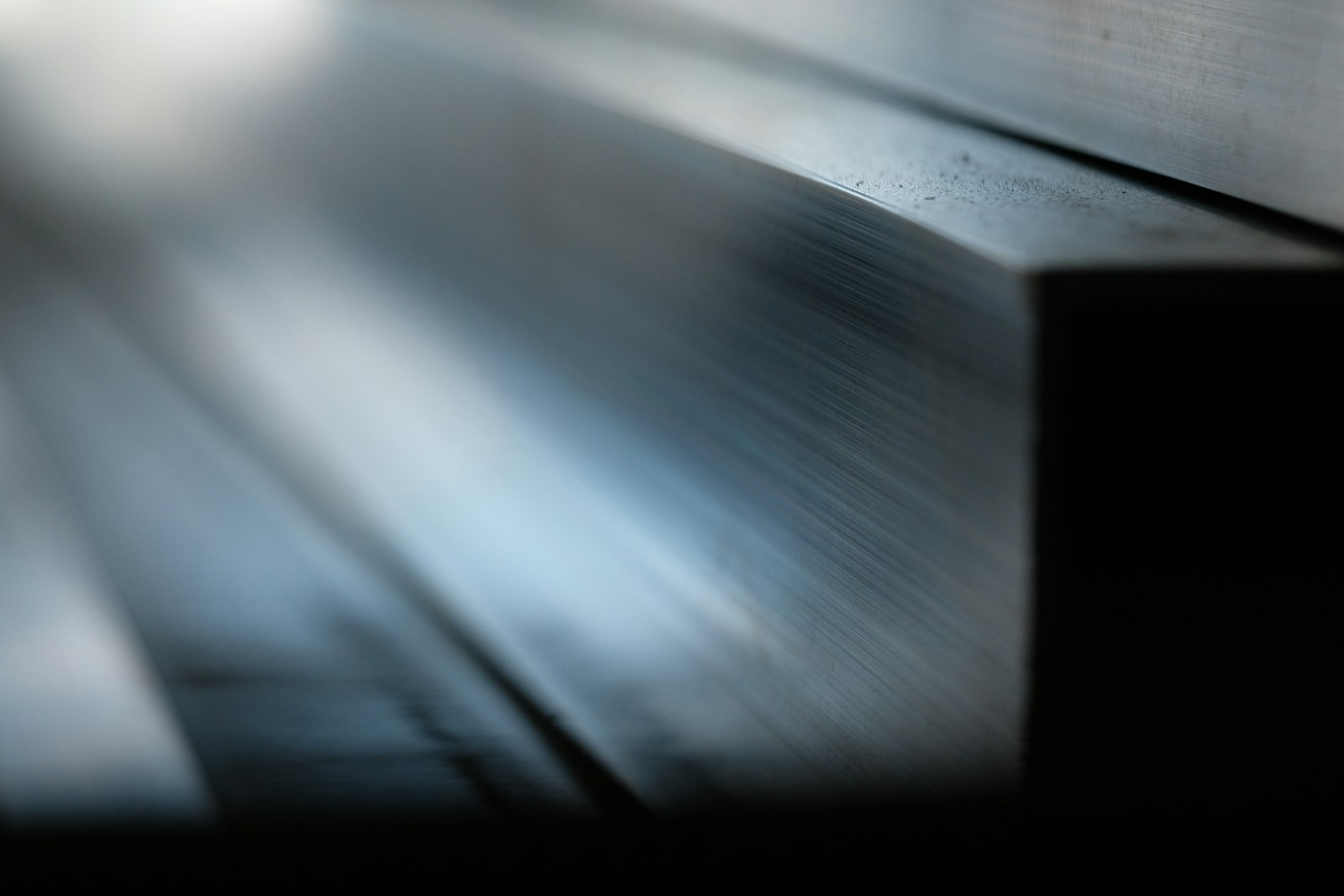 Abstract metallic surface with light reflections